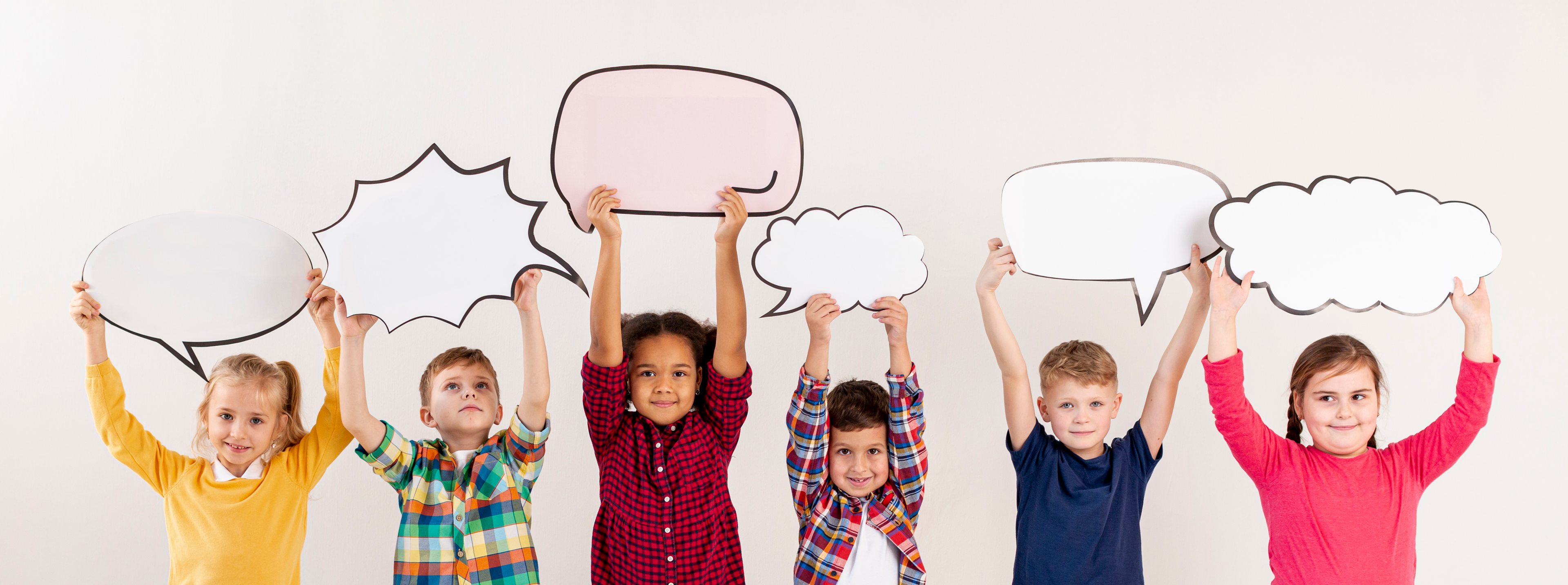 Children holding chat bubbles